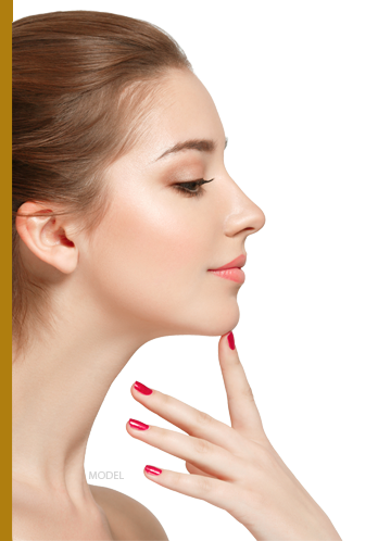 Profile of a young woman pointing at her chin
