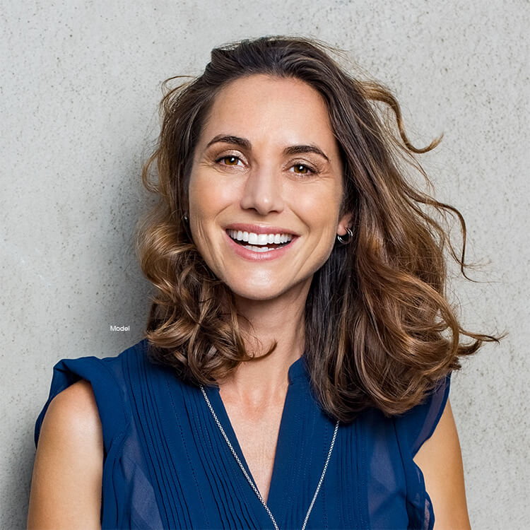 Mature woman with curly hair smiling