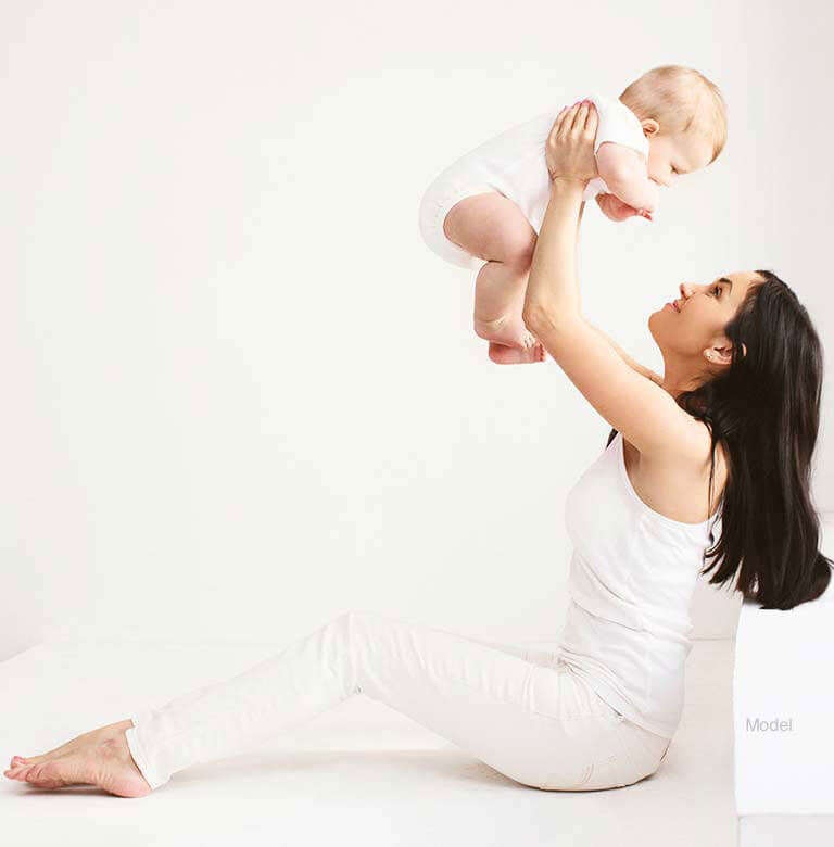 Woman holding a baby in the air