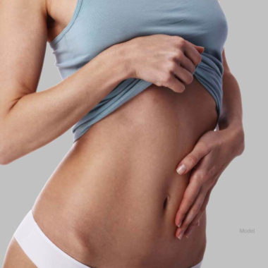 Woman touching her stomach